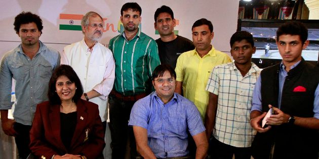 Delhi Lieutenant Governor Najeeb Jung with Para-athletes during the launch of 'InRio' app for Rio 2016 Paralympics Games on September 2, 2015 in New Delhi, India.