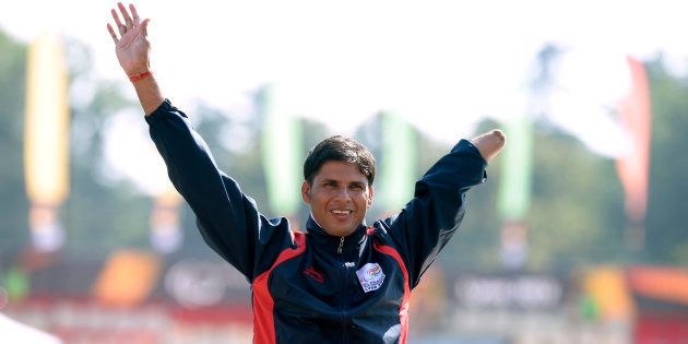 Gold medalist, Indian athlete Devendra Jhajharia, jubilates on the podium after winning the Men's Javelin Throw T46, on July 22, 2013 during of the IPC Athletics World Championships of Lyon at the Rhone Stadium in Venissieux near Lyon.