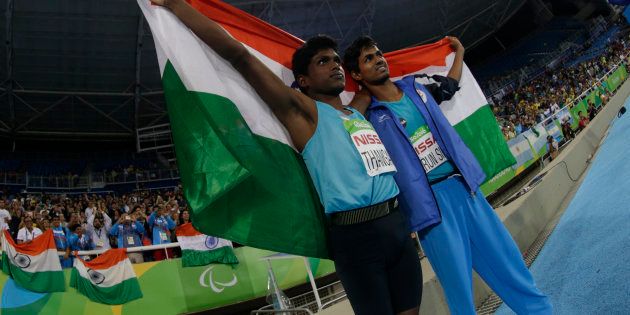 2016 Rio Paralympics - Men's High Jump - T42 Final - Olympic Stadium - Rio de Janeiro, Brazil - 09/09/2016. Gold medalist Mariyappan Thangavelu of India (L) celebrates with compatriot and bronze medal winner Bhati Varun Singh after the event. REUTERS/Ricardo Moraes FOR EDITORIAL USE ONLY. NOT FOR SALE FOR MARKETING OR ADVERTISING CAMPAIGNS.