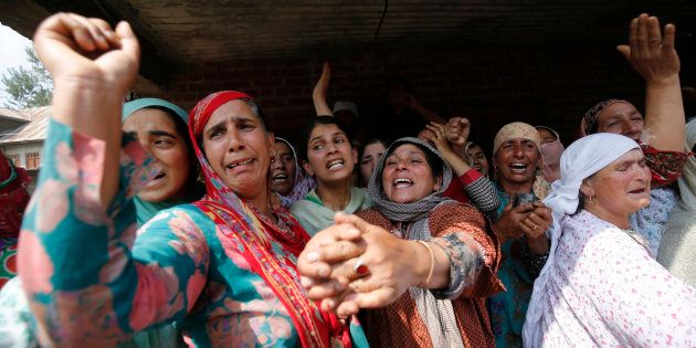 Kashmiri women shout for freedom slogans during a funeral procession of a Javed Ahmad Dar at Wadwan Budgam some 20kms from Srinagar, on September 11, 2016.