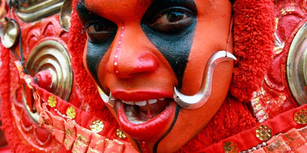 A dancer performs during festivities marking the start of annual harvest festival of Onam in the southern Indian city of Kochi August 14, 2010.