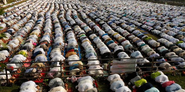 Kashmiri Muslims offer Eid al-Fitr prayers in Srinagar, Indian controlled Kashmir, Wednesday, July 6, 2016.