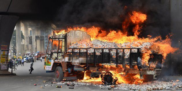A truck from neighbouring Tamil Nadu burns after it was set alight by agitated pro-Karnataka activists in Bangalore on September 12, 2016.