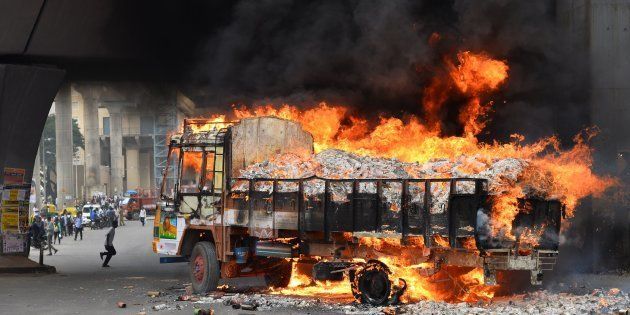 A truck from Tamil Nadu burns after it was set alight by agitated pro-Karnataka activists in Bangalore on September 12, 2016.