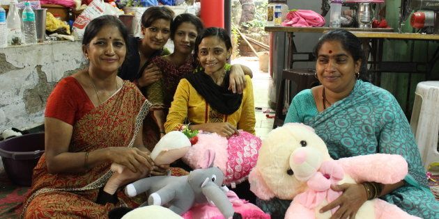 Amita Gupta (left) making one of the Modi dolls with her staff at her toy manufacturing unit.