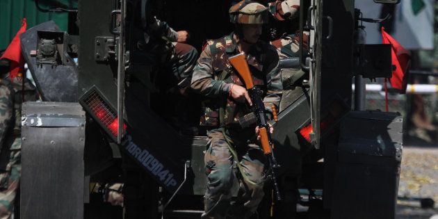 Army soldiers arrive near the army Brigade HQs which was attacked by militant in the border town of Uri.