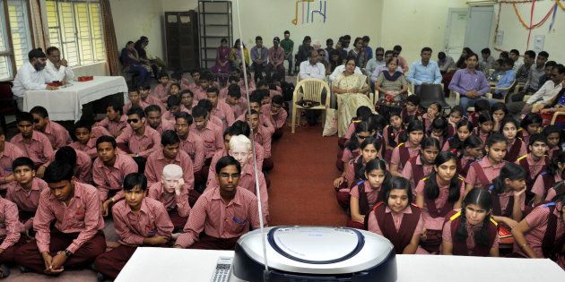 Students listening on the radio a broadcast by Indian Prime Minister Narendra Modi delivering his Teachers' Day speech.
