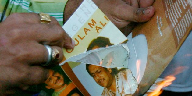 Members of Maharashtra Navanirman Sena (MNS) burn music disks of Pakistani artists during a protest against Pakistan government in Mumbai December 23, 2008.