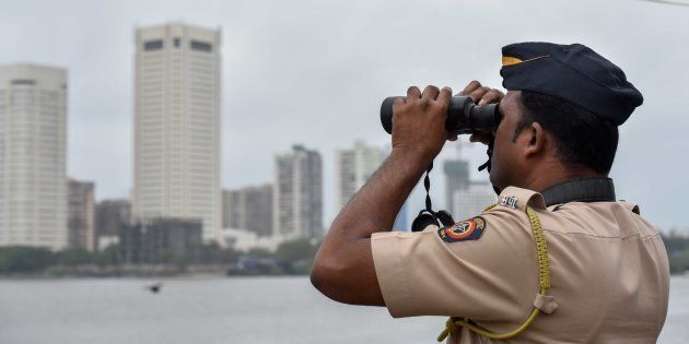 Police Commandos stand guard by the sea coast at Geeta Nagar Colaba due to high alert after a group of men was spotted moving suspiciously near a Naval base at Uran, on September 23, 2016.