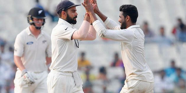 India's Ravindra Jadeja (R) celebrates with his captain Virat Kohli after taking the wicket of New Zealand's Matt Henry. REUTERS/Rupak De Chowdhuri
