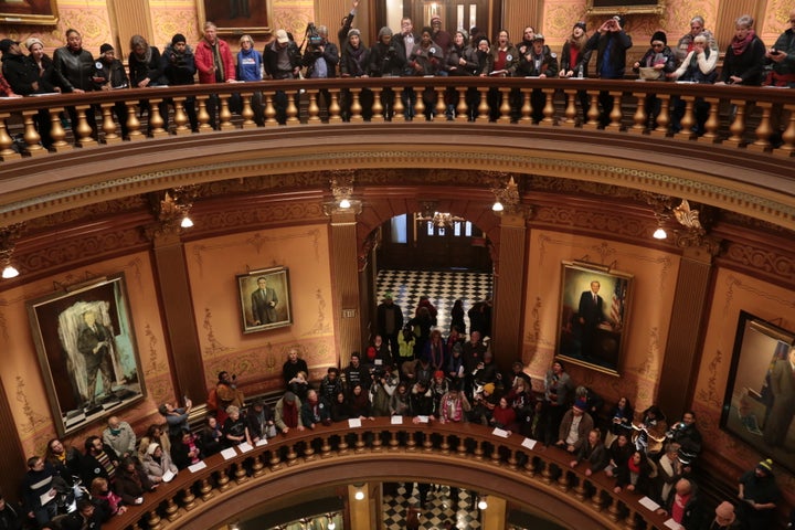 Protesters gather in the Michigan Capitol's rotunda.