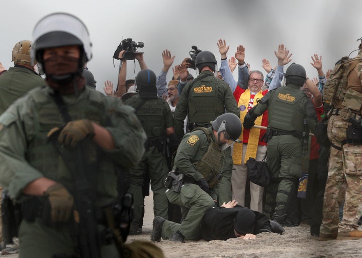 U.S. Border Patrol agents make arrests during a pro-migration protest by members of various faith groups.