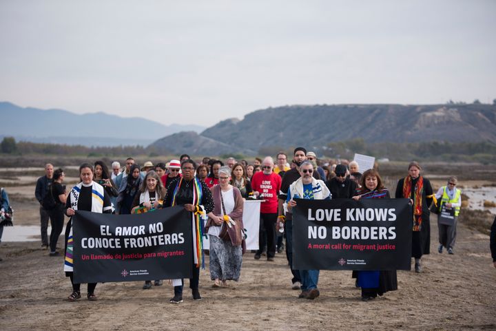 Faith leaders from across the country participate in a march for migrant rights at the San Diego-Tijuana border.