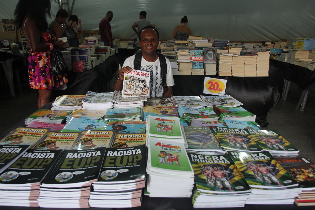 Mauricio Pestana at a book fair in Salvador. His books cover a range of topics, including black and indigenous Brazilian history, as well as stories about Afro-Brazilian orishas.