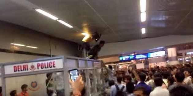 Screen grab of a video showing how three men from Africa were beaten up mercilessly in Rajiv Chowk metro station in September 2014.