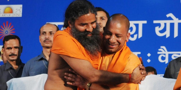 Yog Guru Baba Ramdev and Chief Minister of Uttar Pradesh Yogi Adityanath greeting each other during UP Yog Day programme at Indira Gandhi Auditorium, on March 29, 2017 in Lucknow, India.