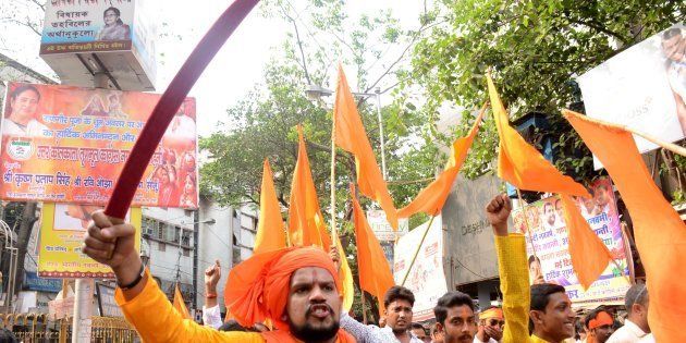 Indian Hindu devotees shouts slogans with sword during the rally on the eve of Ram Navami festival in Kolkata , India on Wednesday , 5th April , 2017.