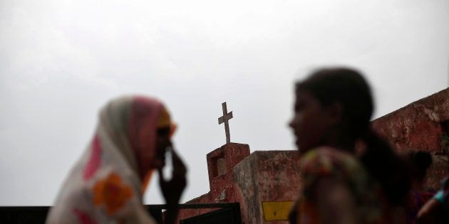 Women speak as they stand outside a church in Uttar Pradesh.