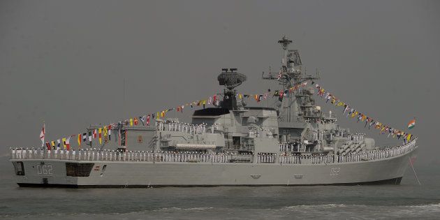 Indian Naval sailors stand on the deck of INS Mumbai.