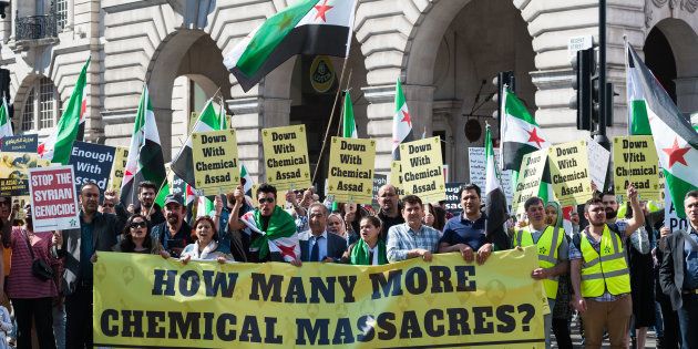 Hundreds of people take part in a protest against the use of chemical warfare in war-torn Syria in response to a recent chemical attack in Khan Sheikhoun in Idlib province, where at least 85 civilians died and hundreds were injured, on April 08, 2017 in London, England.
