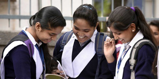 Students revise their lessons before appearing in board exams outside Govt Girls senior secondary school.