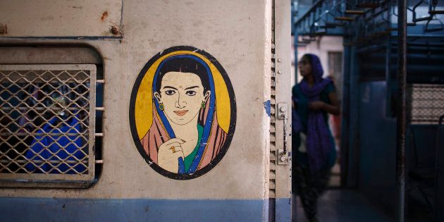 A portrait of a woman is seen near the entrance of the female compartment of a suburban train at Chhatrapati Shivaji Terminus Railway Station in Mumbai November 2, 2012.