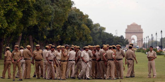 Police officers gather for a briefing near the India Gate in New Delhi.