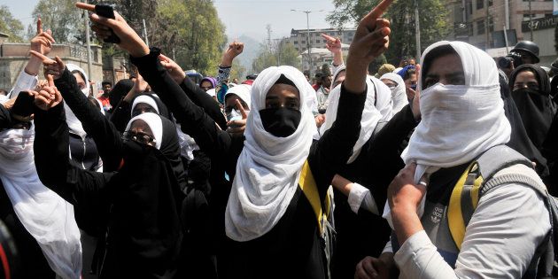 Kashmiri students shout slogans during a protest at Lal Chowk.