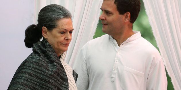 India's main opposition Congress party president Sonia Gandhi (L) and her son and the party's vice-president Rahul Gandhi arrive to address their supporters before what the party calls