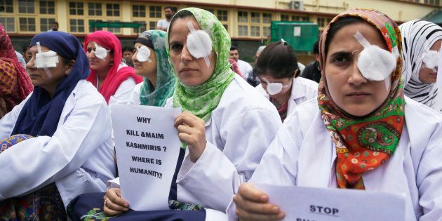 Kashmiri doctors and medical workers wear bandages on their eyes as a mark of protest against the use of pellet guns.