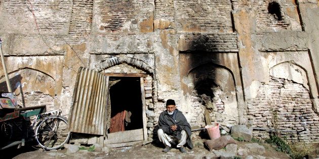 Representative image. Sikander Shah,70, a Kashmiri man, sits at the entrance of his house inside the ruins of Dara Shikuh monument in Srinagar March 8, 2007. Shah and his wife arrived in the ruins of the 440 year-old monument, which was built by Mughal prince Dara Shikuh, about 38 years ago and now live there with their four children and two grandchildren, the couple said. Picture taken March 8, 2007. REUTERS/Danish Ismail