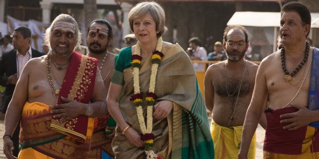 British Prime Minister Theresa May is welcomed to the Sri Someshwara Temple on November 8, 2016 in Bangalore, India.