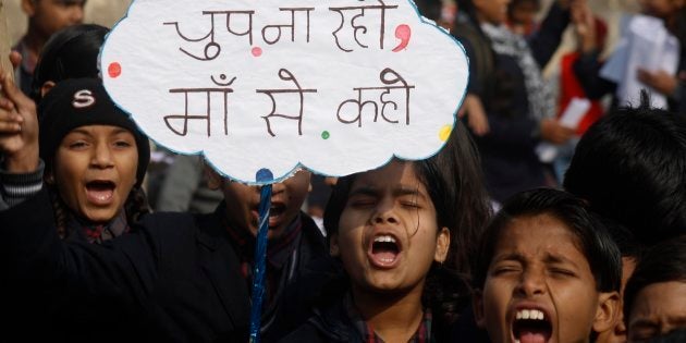 Indian children shouting slogans to create awareness about child sexual abuse in a rally.