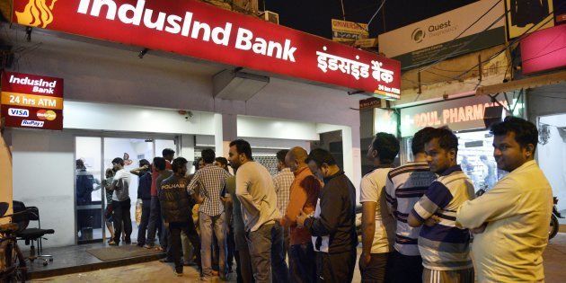 People queue up outside ATMs to withdraw hundred rupee notes at sector 12 on November 8, 2016 in Noida, India. (Photo by Mohd Zakir/Hindustan Times via Getty Images)
