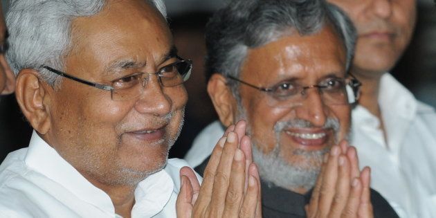 Bihar Chief Minister Nitish Kumar with Deputy Chief Minister Shushil Mody at Oath ceremony of Ministers at Raj Bhawan, on July 29, 2017 in Patna.