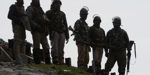Indian paramilitary soldiers guard outside a polling station during a re-polling of a by-election for a vacant seat in India's Parliament in Dooniwari, on April 13, 2017 in Kashmir, India.The re-poll was ordered by Indian authorities in 38 polling centers after Sundays voting process was disrupted by violence that killed eight civilians.PHOTOGRAPH BY Imran Bhat / Barcroft ImagesLondon-T:+44 207 033 1031 E:hello@barcroftmedia.com -New York-T:+1 212 796 2458 E:hello@barcroftusa.com -New Delhi-T:+91 11 4053 2429 E:hello@barcroftindia.com www.barcroftimages.com (Photo credit should read Imran Bhat / Barcroft Images / Barcroft Media via Getty Images)