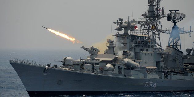 A rocket is fired from the Indian Navy destroyer ship INS Ranvir during an exercise drill in the Bay Of Bengal off the coast of Chennai on April 18, 2017.