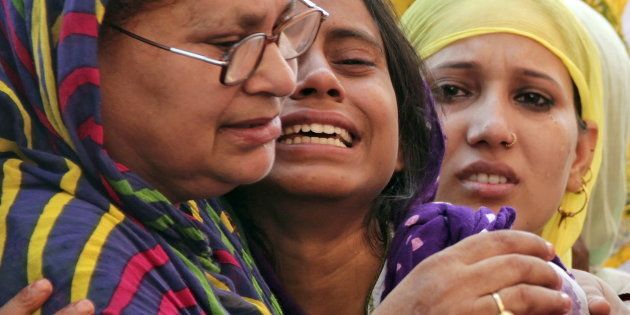 Relatives of Mohammad Akhlaq mourn after he was killed by a mob at his residence in Dadri town, in Uttar Pradesh.