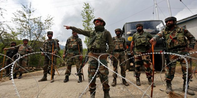 Indian army soldiers stand guard inside their army base after it was attacked by suspected separatist militants in Panzgam in Kashmir's Kupwara district.