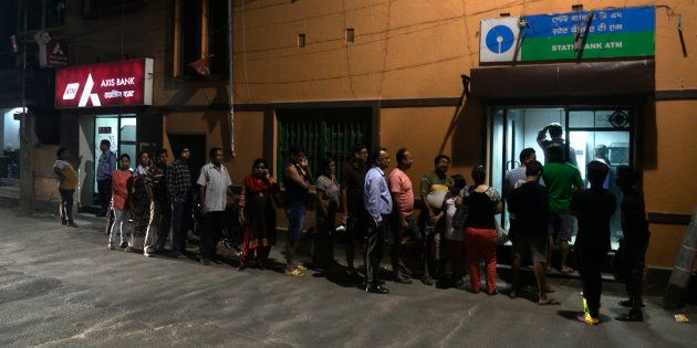 People rush to ATM machines to collect money after the declaration that Rs 500 and Rs 1000 currency notes will be demonetised.
