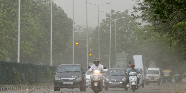Commuters driving during the dust storm and strong winds, on April 22, 2017 in Chandigarh, India.