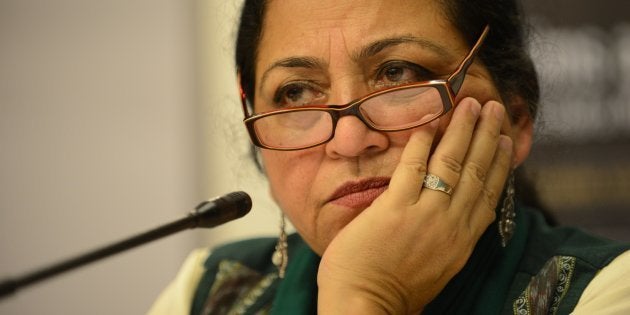 Indian author Madhu Kishwar looks on as she addresses media representatives in Ahmedabad.