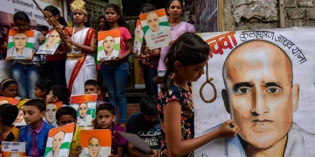 Photo of Kulbhushan Yadav by Gurukul students of art seen as part of a protest against his death sentence at Lalbaugh, on April 15, 2017 in Mumbai.