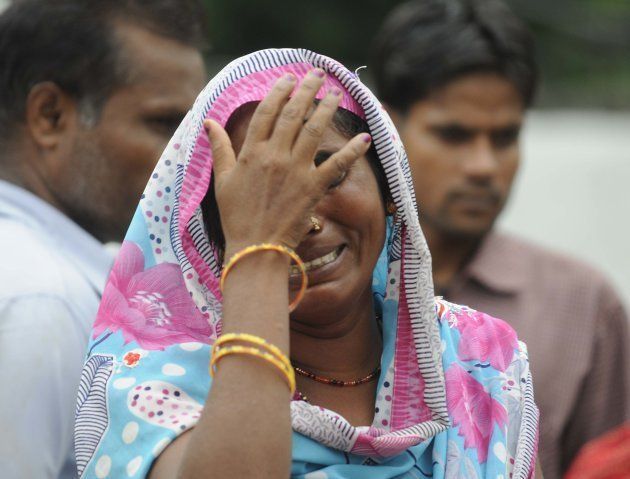 A lady mourns the death of a child at BRD medical college, around 70 children have died for various reasons including lack of oxygen supply in last few days in Gorakhpur, on August 13, 2017 in Lucknow.