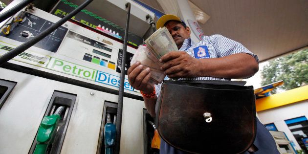 File photo of an employee counting Indian currency at a fuel station in Mumbai.