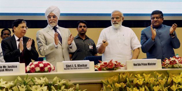 PM Narendra Modi launching the Supreme Court's integrated case management system in New Delhi on 10 May 2017. Chief Justice of India, Justice Jagdish Singh Khehar and Union Law Minister Ravishankar Prasad are also seen.