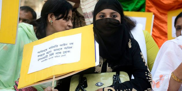 KOLKATA, WEST BENGAL, INDIA - 2016/11/18: Muslim women holds poster to protest Triple talaq Bharatiya Janata Party (BJP) Mohila Morcha ( Women Wing) against Muslims triple Talaq tradition that demand one country one law in Wellington Square, Kolkata. Union Government take an initiative to introduce uniform civil code in Indian but Muslim personal law board and other Muslim organization oppose the decision. (Photo by Saikat Paul/Pacific Press/LightRocket via Getty Images)
