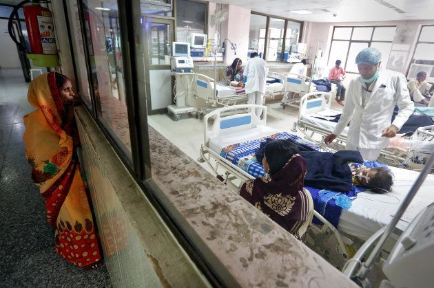 A woman looks into the intensive care unit (ICU) at the Baba Raghav Das hospital in the Gorakhpur district, India August 14, 2017.