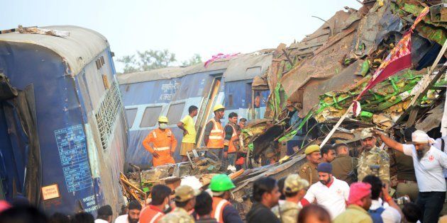 Rescue workers search for survivors in the wreckage of a train that derailed near Pukhrayan in Kanpur district on November 20, 2016. SANJAY KANOJIA/AFP/Getty Images