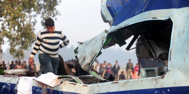 A relative attempts to identify luggage belonging to a family member who was killed in a train accident in Kanpur on November 21, 2016. Emergency workers raced to find any more survivors in the mangled wreckage of an Indian train that derailed on November 20, killing at least 120 people, in the worst disaster to hit the country's ageing rail network in recent years. Rescue workers were searching for survivors believed still trapped inside the badly mangled coaches of the Patna-Indore express after the crash near Kanpur in Uttar Pradesh state. / AFP / SANJAY KANOJIA (Photo credit should read SANJAY KANOJIA/AFP/Getty Images)